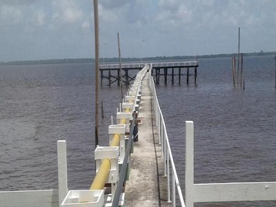 Marine bunkering vessel refuelling a ship at port in Guyana